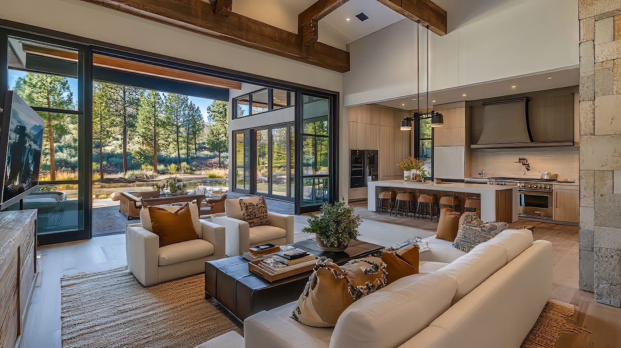 Light-filled California Casual living room with exposed wood beams, neutral sofas, layered textures, built-in shelving, and a warm, relaxed coastal feel