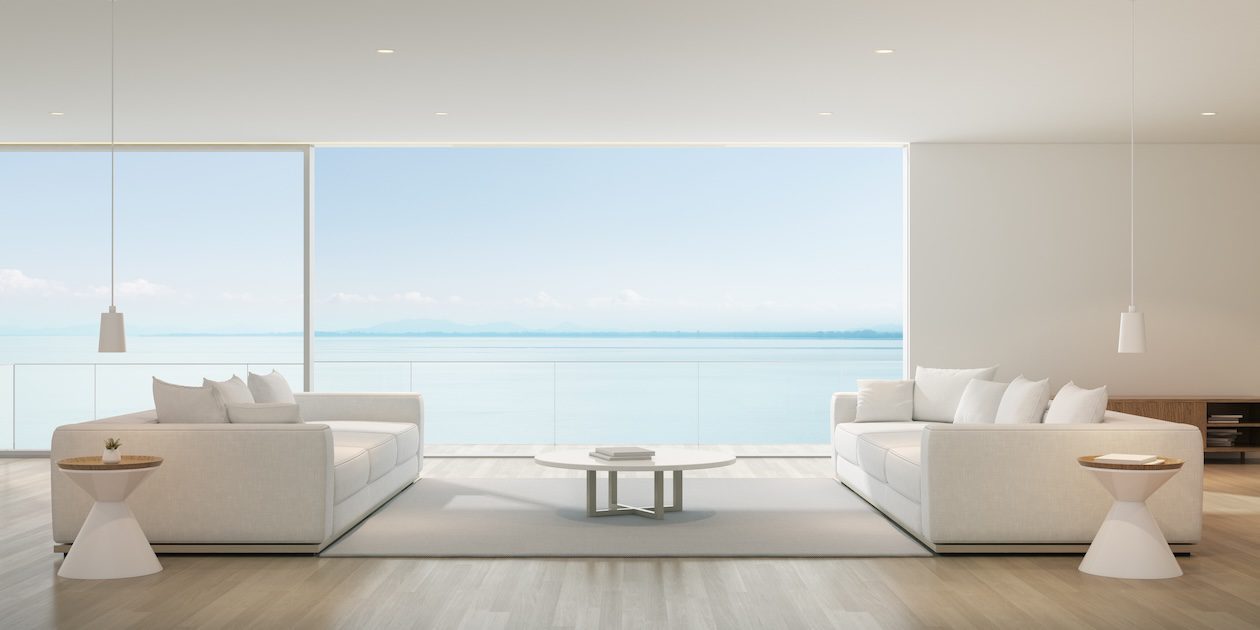 Large glass openings and sliding doors blur the line between indoors and outdoors.