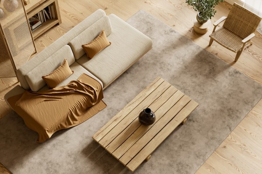 Top view of neutral minimalist living room with warm wood textures, layered textiles, and balanced Japandi-style interior design
