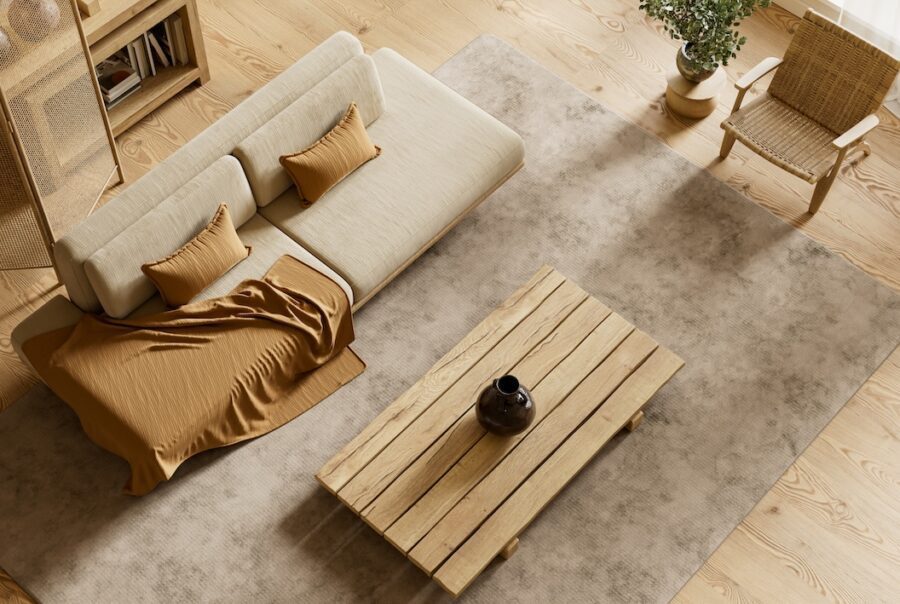 Top view of neutral minimalist living room with warm wood textures, layered textiles, and balanced Japandi-style interior design