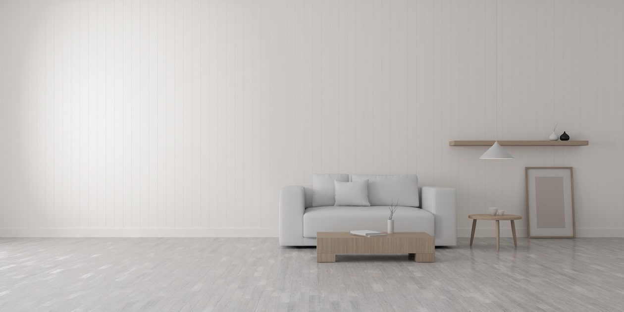 Minimal white living room with wood furniture and clean lines, showing a simple Scandinavian-style space that can feel flat without layered textures