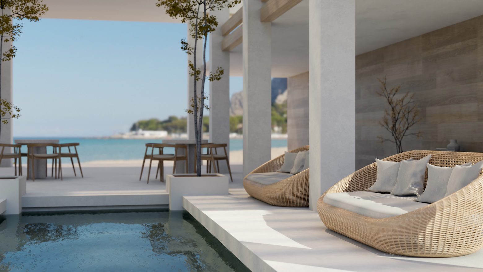 Coastal outdoor room featuring woven lounge chairs, performance fabric cushions, and covered waterfront seating designed for indoor-outdoor living and entertaining.