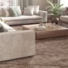 Bright coastal living room with neutral upholstered seating, natural textures
