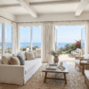 Custom drapery in a Rancho Santa Fe living room with large estate-scale windows, WRF Design Center