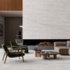 Modern California casual living room featuring a custom upholstered sectional, neutral color palette, natural wood accents, and floor-to-ceiling windows.