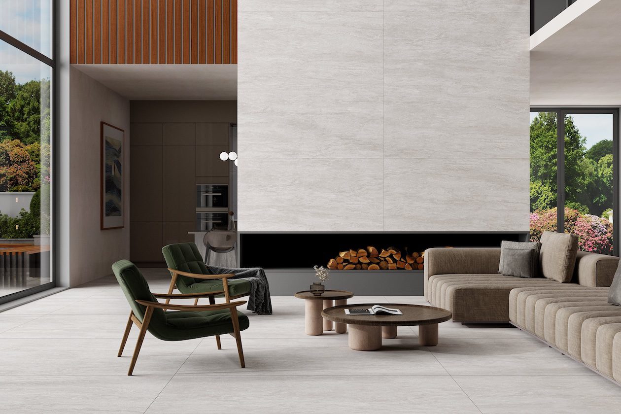 Modern California casual living room featuring a custom upholstered sectional, neutral color palette, natural wood accents, and floor-to-ceiling windows.